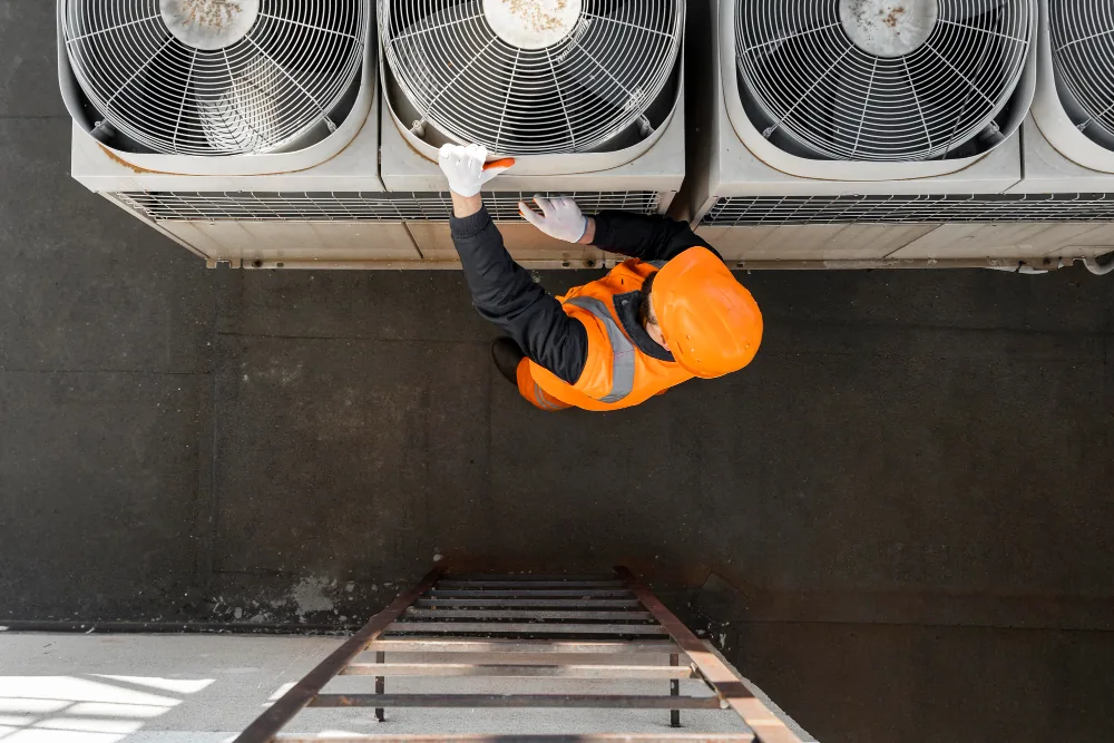 Coolora AC Service technician servicing an outdoor AC unit