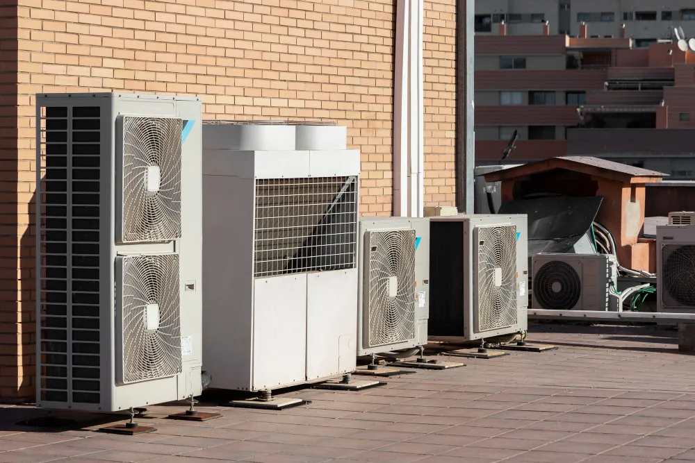 Commercial AC condenser units installed on a rooftop